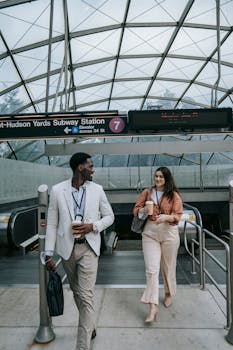 Couple on top of Escalator at Subway Station