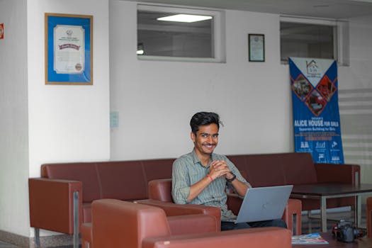 Focused and determined, this young boy harnesses the power of technology as he diligently works on his laptop, shaping a future filled with endless possibilities.