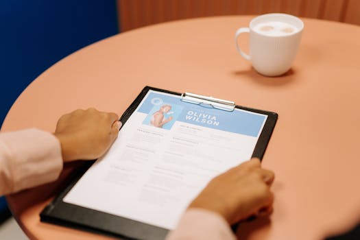 Person Holding Black Tablet Computer