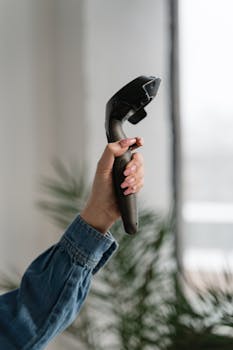 Person Holding Black and Gray Hand Tool