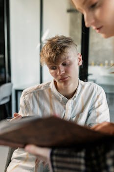 Two People Discussing Over a Project