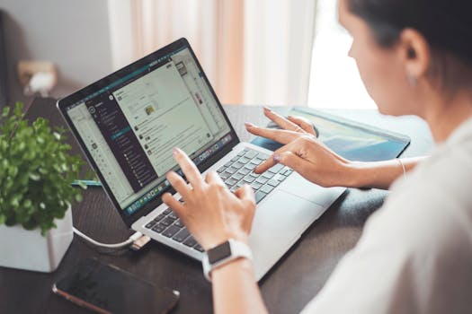 Woman Using a Laptop at a Table